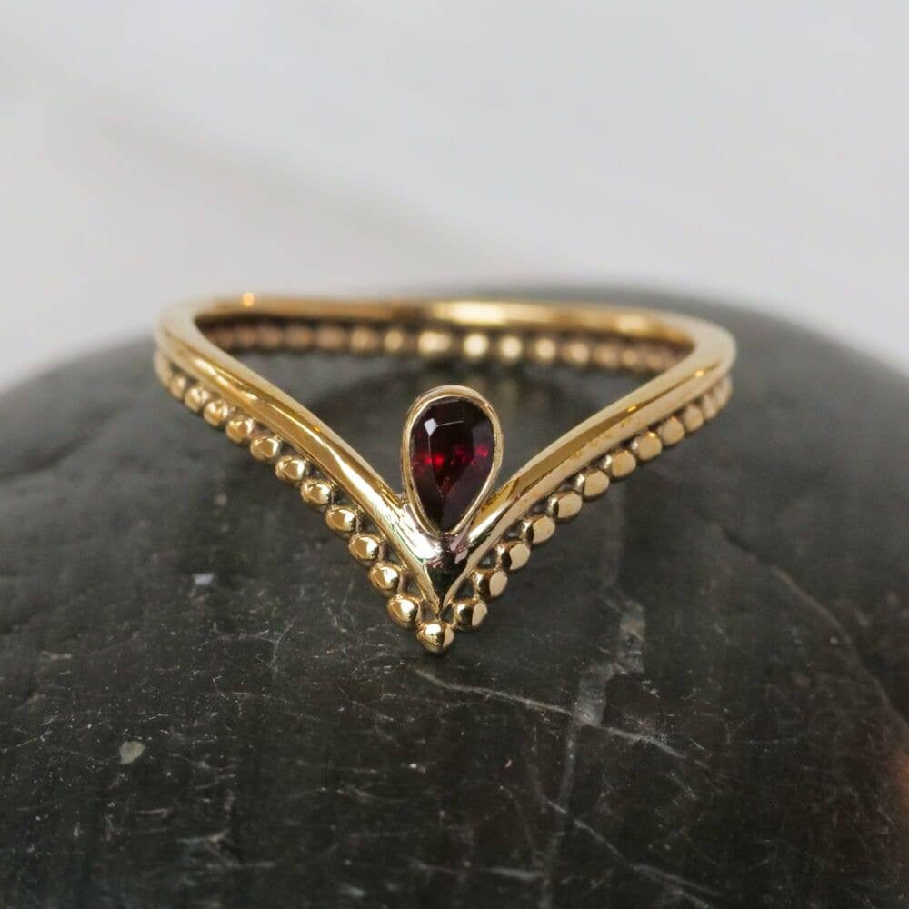 Baizaar - Brass Spotted Chevron Ring with Garnet Stone